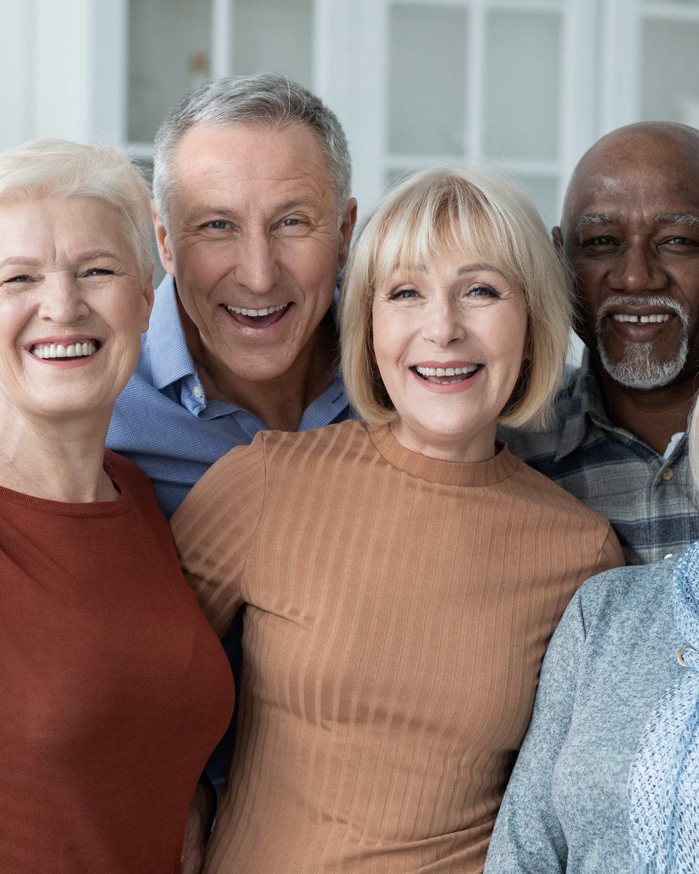 A group of retirees together, smiling