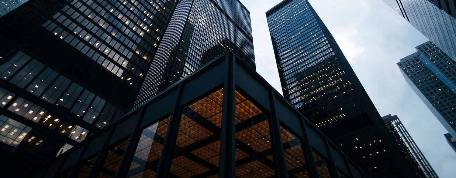 Office towers against a grey sky