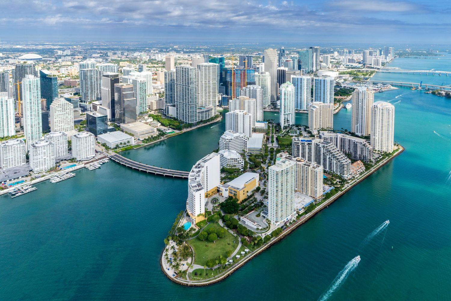 The downtown Miami skyline of high-rise towers seen from the water.
