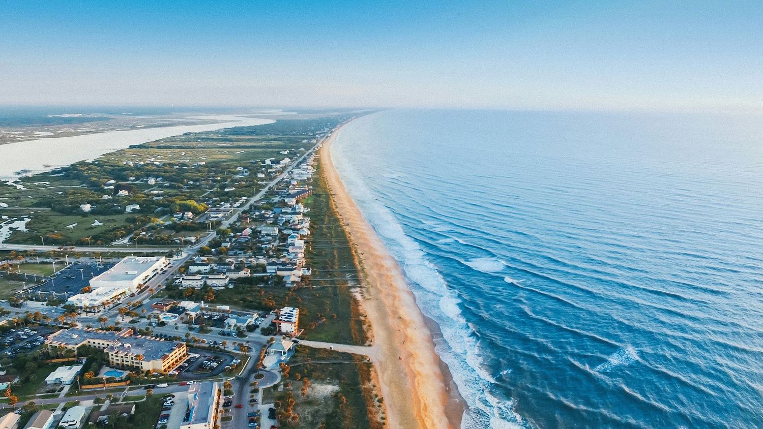 An aerial view of a Florida beach town along the shoreline.
